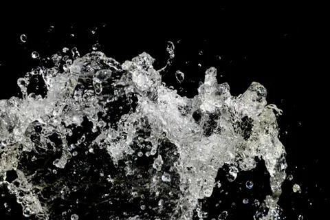 Water splash isolated on black background Stock Photos