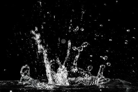 Water splash isolated on black background Stock Photos