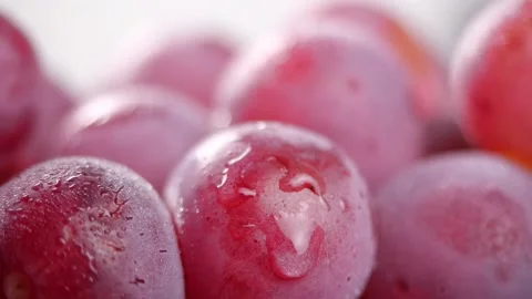 Water splash on a red grape in slow motion Stock-Footage 143373724