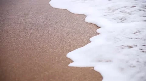Water splash, sea waves on sandy beach closeup Stock Footage 51940660