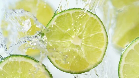 Water splash on sliced lime. Slow Motion. Stock Footage 87239191