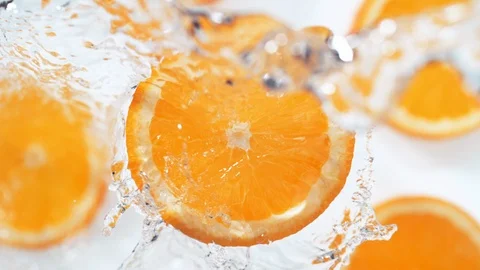 Water splash on sliced orange. Slow Motion. Video stock 87238577