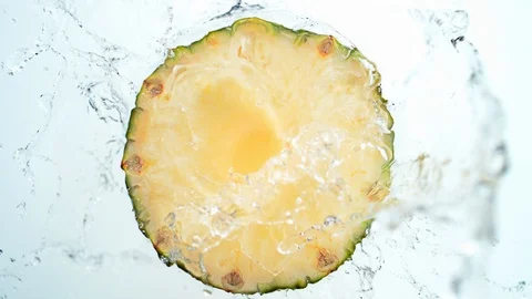 Water splash on sliced pineapple. Slow Motion. Stock Footage 87239006