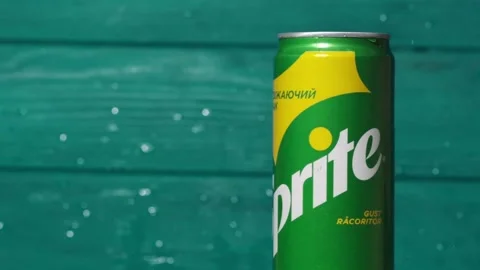 Water splash in a slow motion over classic Sprite green can Stock Footage 242419944