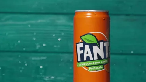 Water splash in a slow motion over classic Fanta orange can Stock Footage 246707979