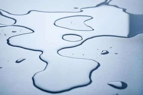 Water splash on table in front light Foto stock