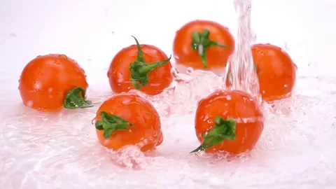 Water Splash on Tomatoes. Stock Footage 73551931