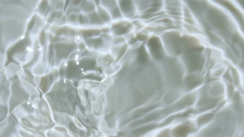 Water splash. Water Drop Creating Ripple. Pure water with reflections sunlight Stock Footage 165555602