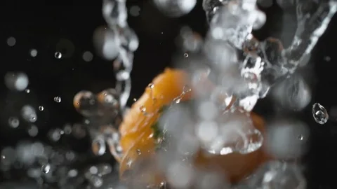 Water splash on yellow pepper. Slow Motion. Stock Footage 79478700