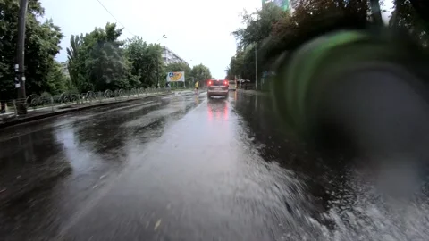 Water splashes after car driving over puddle. Stock Footage 145490058