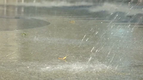 Water splashes against the asphalt Stock Footage 209117462
