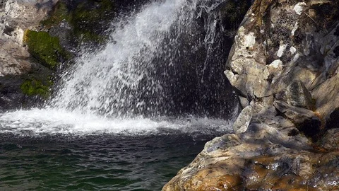 Water splashes at base of waterfall, Washington State. Stock Footage 98011668
