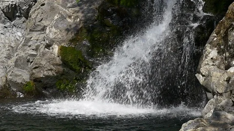 Water splashes at base of waterfall, Washington State. Stock Footage 98011775