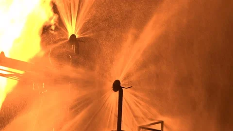 Water splashes. Flame of fire. Fire extinguishing system. Water is sprayed in Stock Footage 165952876