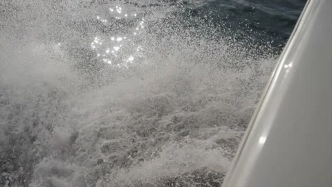Water splashes from a floating boat Video stock 217687857