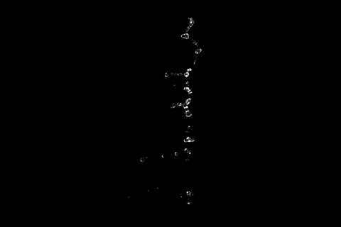 Water splashes isolated on black background. white jets with drops 스톡 사진