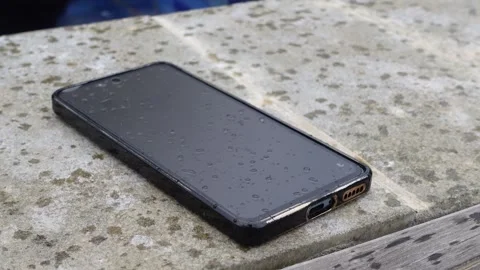 Water splashes on the phone screen Stock Footage 317624118