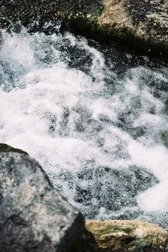 Water splashes. Shore. Stock Photos
