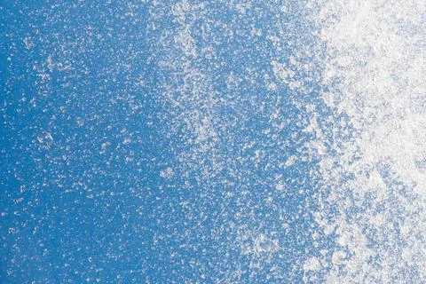 Water splashes of stream flow on blue sky background, closeup Stock Photos