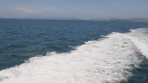 Water splashes on surface Water From the back of fast moving motor boat Stock Footage 113284887