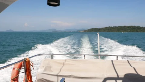 Water splashes on surface Water From the back of fast moving motor boat Stock Footage 113285458