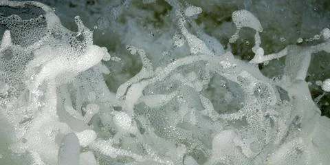 Water splashes from waterfall close-up. Stock Photos