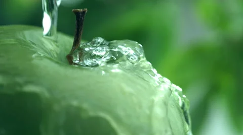Water splashing on apple in slow motion; shot on Phantom Flex 4K at 1000 fps Stock Footage