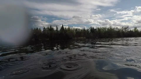 Water Splashing on a Camera from a Kayak Paddle Passing Through the Water Stock Footage 195591110