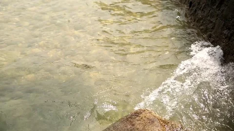 Water splashing off the coast. Wave on the surface of the water. Stock Footage 120105254