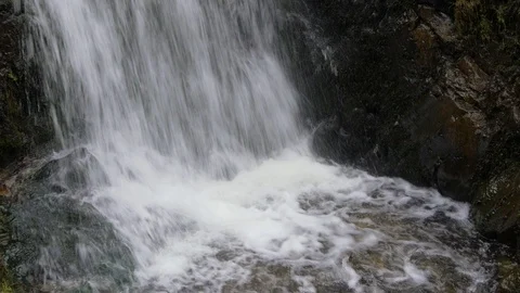 Water splashing down at bottom of waterfall Video stock 94509427