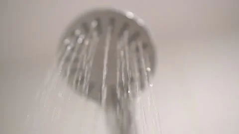 Water splashing down from a ignition shower head. Stock Footage 132212192