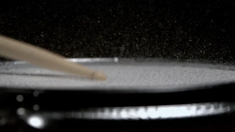 Water Splashing Off of Drum Getting Hit with Drumstick in Slow Motion Видео 270404390