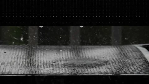 Water splashing up from a grid or grille during a downpour Stock Footage 157302303