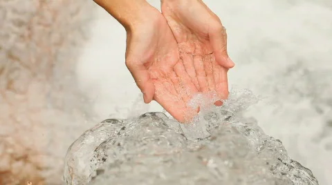 Water splashing in hands Stock Footage 525544