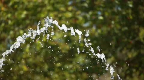 Water splashing over blurred backgorund Stock Footage