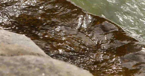 Water splashing on rocks stock footage sound Stock Footage