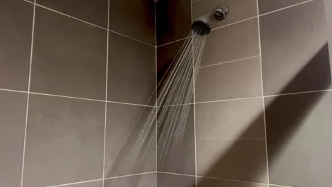 Water Splashing from Shower, Capturing Light and Energy Stock Footage 302618700