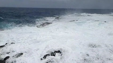 Water spout between the sea and the rocks slow motion Stock Footage 155129527