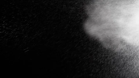 Water Spray on Black Background. Micro Drops of Water Fly in the Air. Slow Stock Footage