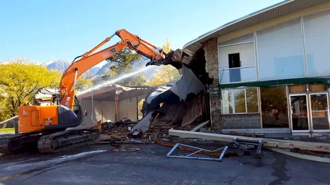 Water sprayed for dust suppression landmark building demolished in Provo, Utah Stock Footage 97240396