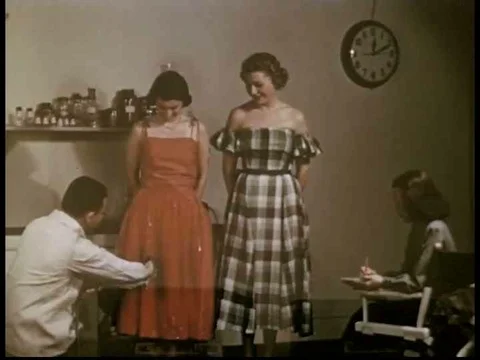 Water is sprayed on models in dresses to illustrate water-resistance and aƒ Stock Footage 75769239