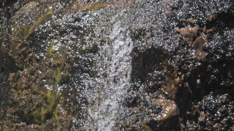 Water spring falling on rock mountains 動画素材 111603489