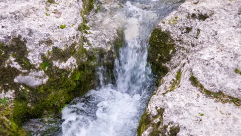 Water spring in a rock - clear stream whitewater and cascade. Natural resources Stock Footage 268748665