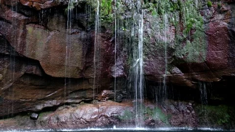 Water spring running down the cliffs, rocks. Travel the world Stock Footage 171912204