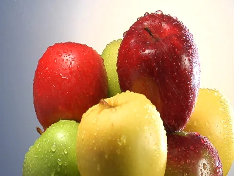 Water sprinkling on stack of apples Stock Footage 46585198