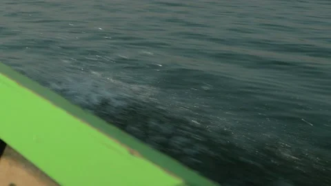Water spurting at high speed from a typical boat on Inle Lake, Mynamar Stock Footage 236744369