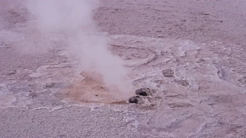 Water steam getting out from two holes at El Tatio Geyser Field Stock Footage 238628067