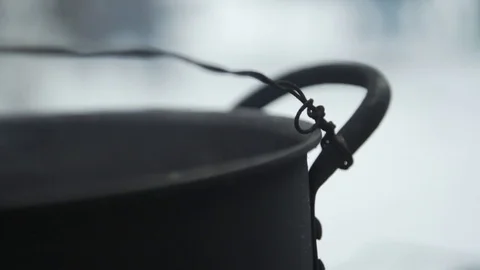 Water steaming in a black tin Stock Footage 79792176