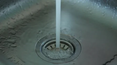 Water stops flowing in a sink Stock Footage 63456034