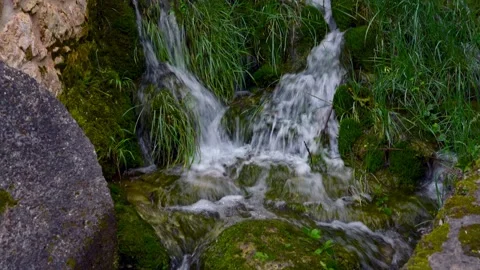 Water stream and waterfall under the bridge Stock Footage 153537139